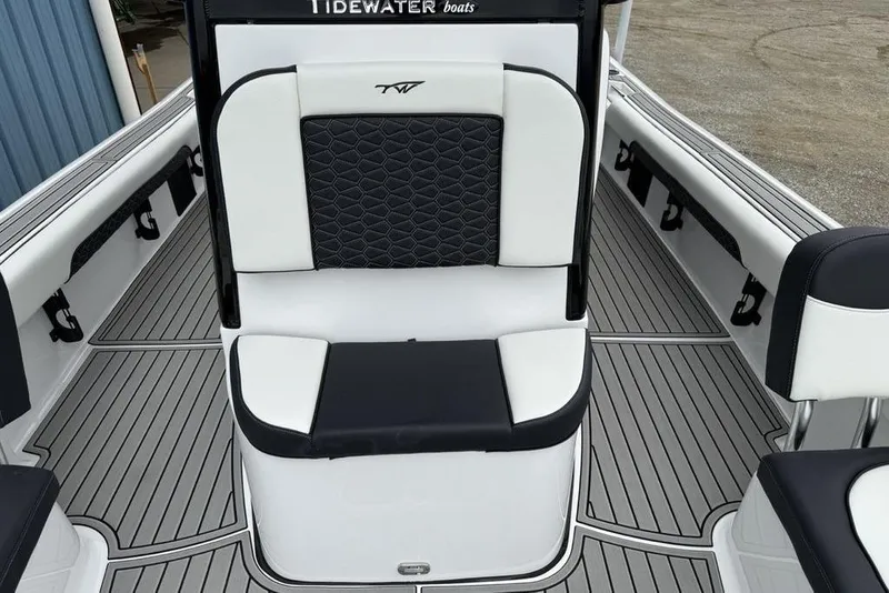 Slide: The Image of 2026 Tidewater 2500 Carolina Bay boat interior with black and white seating and deck. - 21