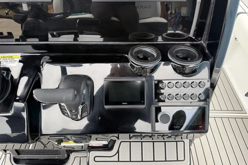 Slide: The Image of Control panel of 2026 Tidewater 2500 Carolina Bay boat with modern navigation equipment. - 25