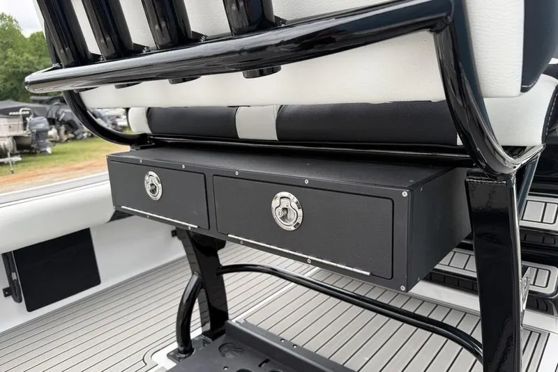 Slide: The Image of 2026 Tidewater 2500 Carolina Bay boat seat with storage drawers and sleek design. - 27
