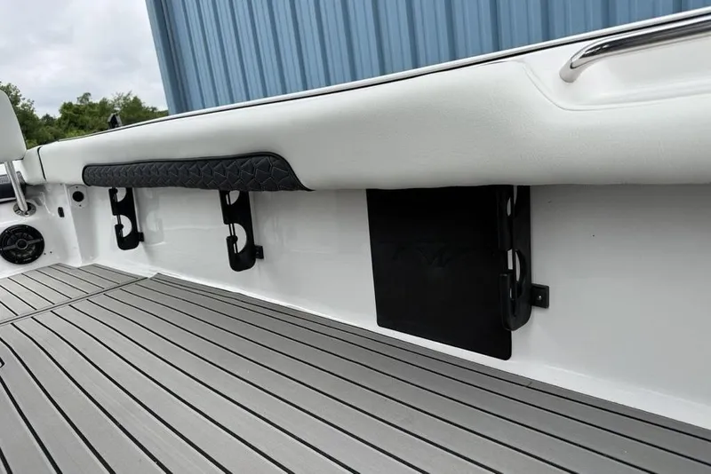 Slide: The Image of 2026 Tidewater 2500 Carolina Bay boat interior with sleek deck and storage features. - 36