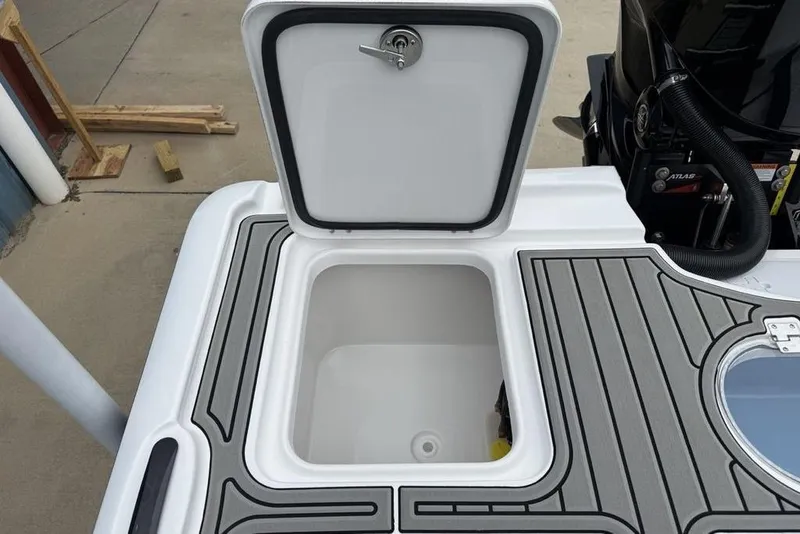 Slide: The Image of Open storage compartment on 2026 Tidewater 2500 Carolina Bay boat deck. - 38