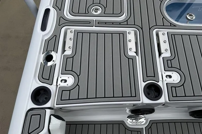 Slide: The Image of 2026 Tidewater 2500 Carolina Bay boat deck with sleek, modern design and storage compartments. - 39