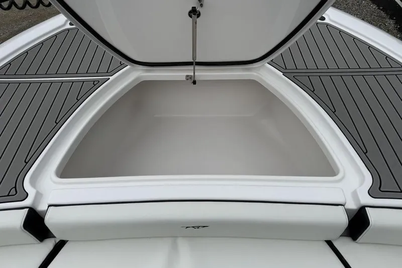 Slide: The Image of Open storage compartment on 2026 Tidewater 2500 Carolina Bay boat, featuring sleek design. - 8