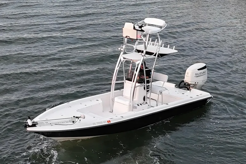 Slide: The Image of 2009 ShearWater 2400Z boat with Suzuki outboard motor on open water. - 15