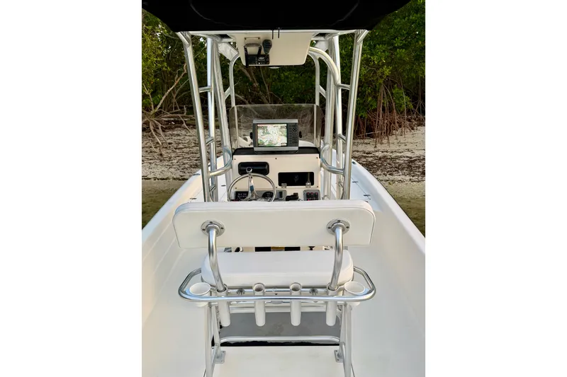Slide: The Image of 2009 ShearWater 2400Z boat interior with steering console and navigation equipment. - 22