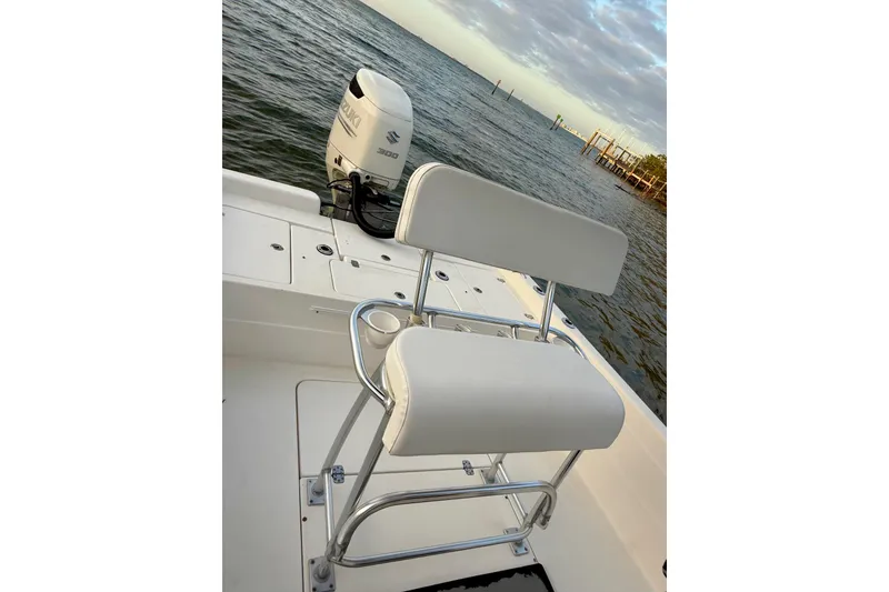 Slide: The Image of 2009 ShearWater 2400Z boat with Suzuki 300 engine on calm water. - 25