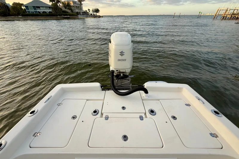 Slide: The Image of 2009 ShearWater 2400Z boat with Suzuki 300 engine on calm waters. - 26