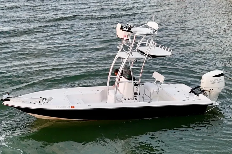 Slide: The Image of 2009 ShearWater 2400Z boat with Suzuki outboard motor on water. - 7