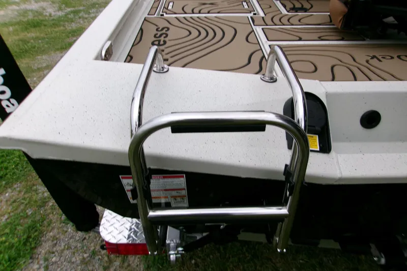 Slide: The Image of 2026 Xpress H22B Bay boat with stainless steel ladder and textured deck. - 10