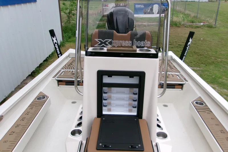 Slide: The Image of 2026 Xpress H22B Bay boat interior with storage compartments and seating. - 14