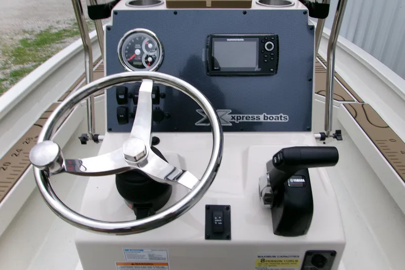 Slide: The Image of Steering console of 2026 Xpress H22B Bay boat with Yamaha controls and navigation display. - 15