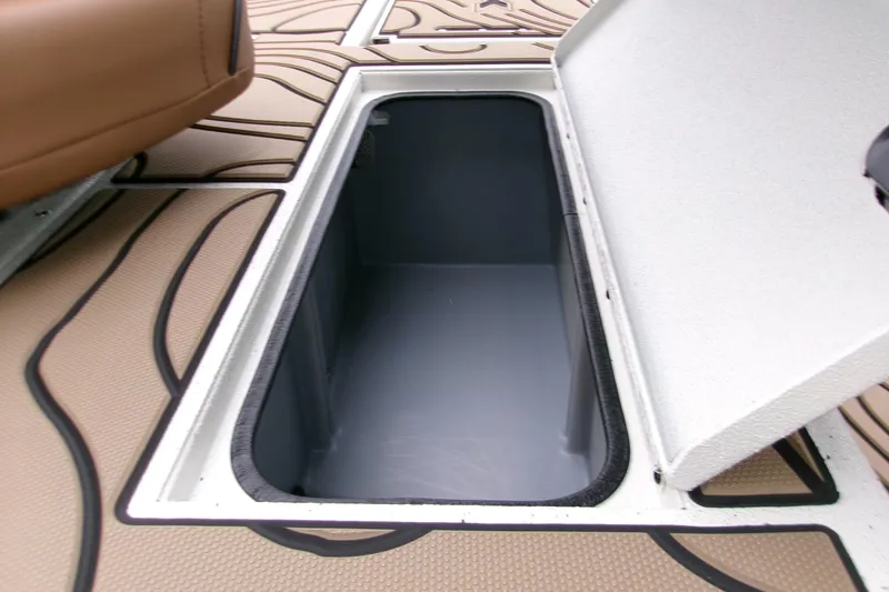 Slide: The Image of Open storage compartment on 2026 Xpress H22B Bay boat deck. - 16