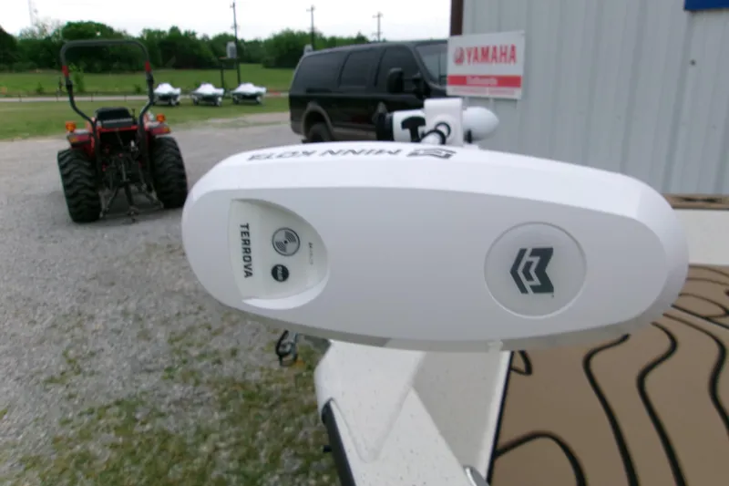 Slide: The Image of 2026 Xpress H22B Bay boat with Minn Kota Terrova trolling motor in outdoor setting. - 24