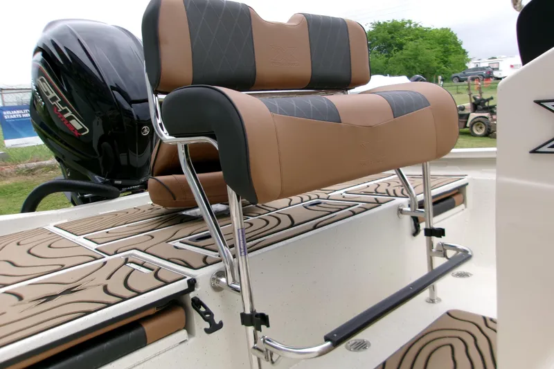 Slide: The Image of 2026 Xpress H22B Bay boat with cushioned seating and sleek design. - 6