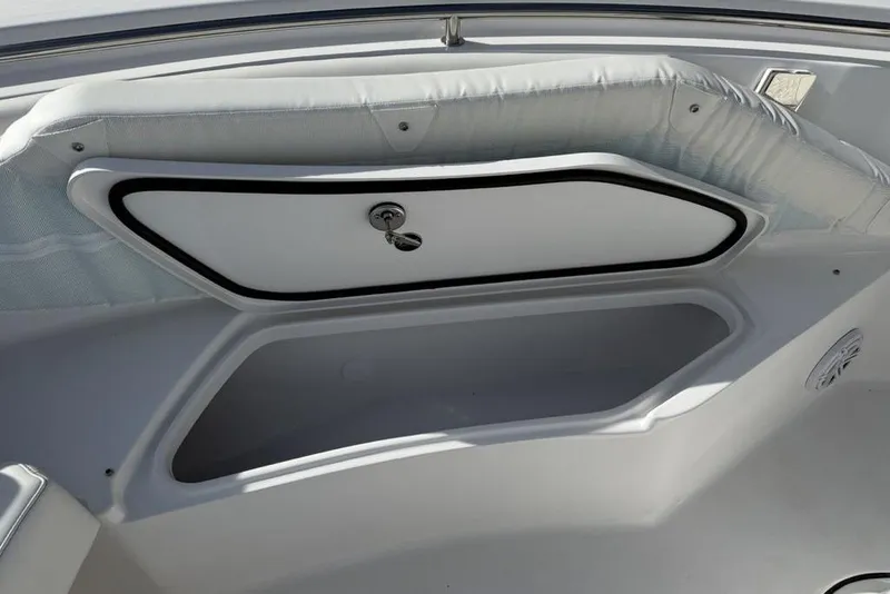 Slide: The Image of Storage compartment on 2026 Tidewater 232 LXF boat, featuring sleek design and secure latch. - 16