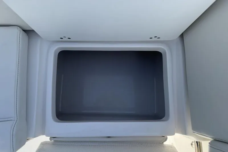 Slide: The Image of Storage compartment in 2026 Tidewater 232 LXF boat, featuring sleek design and ample space. - 24