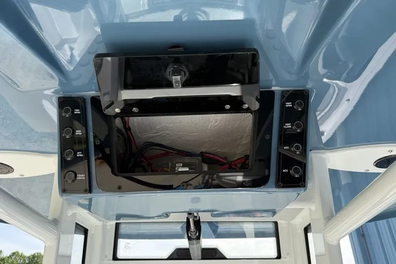 Slide: The Image of 2026 Tidewater 232 LXF boat dashboard with control panel and wiring. - 31