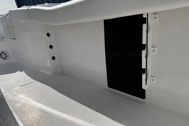 Slide: The Image of Interior view of 2026 Tidewater 232 LXF boat, featuring sleek white design and storage compartments. - 32