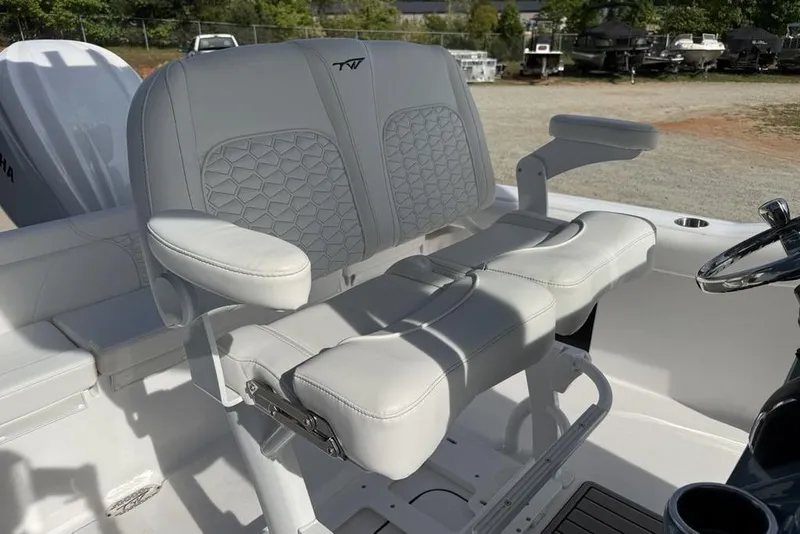 Slide: The Image of 2026 Tidewater 232 LXF boat interior with dual captain's seats and steering wheel. - 33