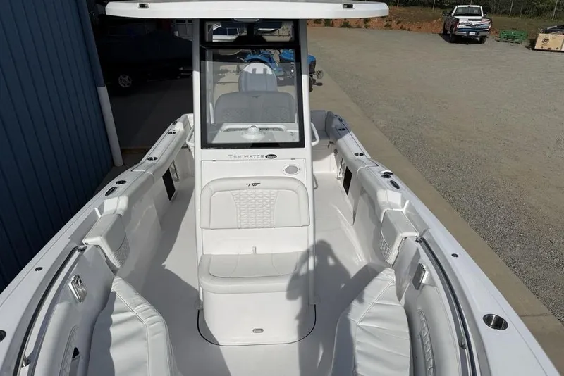 Slide: The Image of 2026 Tidewater 232 LXF boat interior with white seating and console. - 36