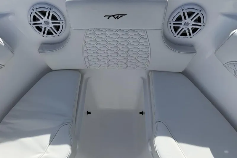 Slide: The Image of Interior of 2026 Tidewater 232 LXF boat with white seating and speakers. - 9
