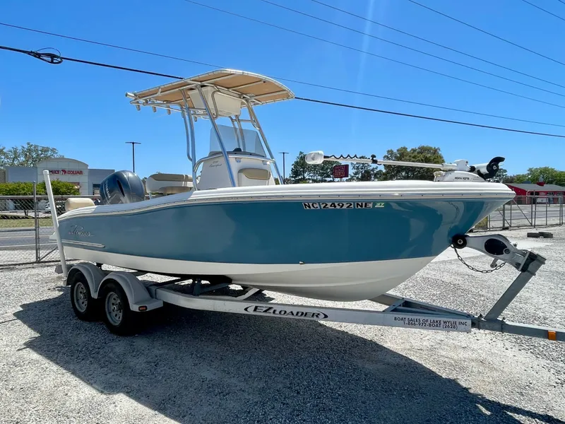 Slide: The Image of 2020 Pioneer 202 Sportfish boat on trailer outdoors. - 11