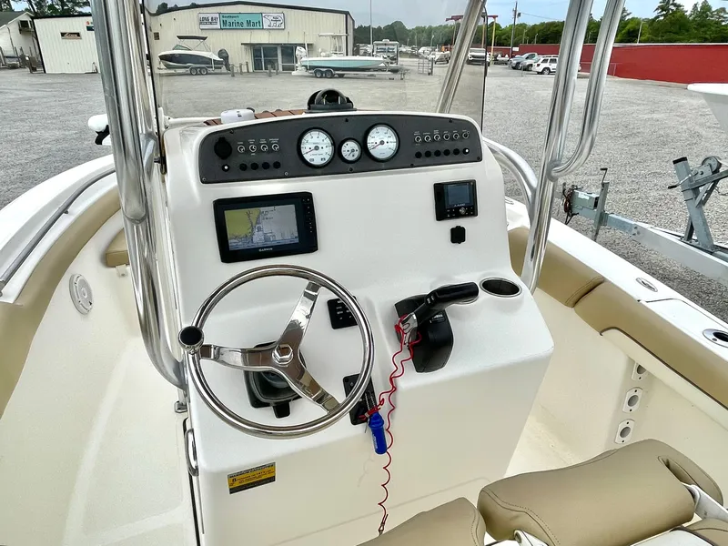 Slide: The Image of Pioneer 2020 202 Sportfish boat console with controls and instruments. - 13