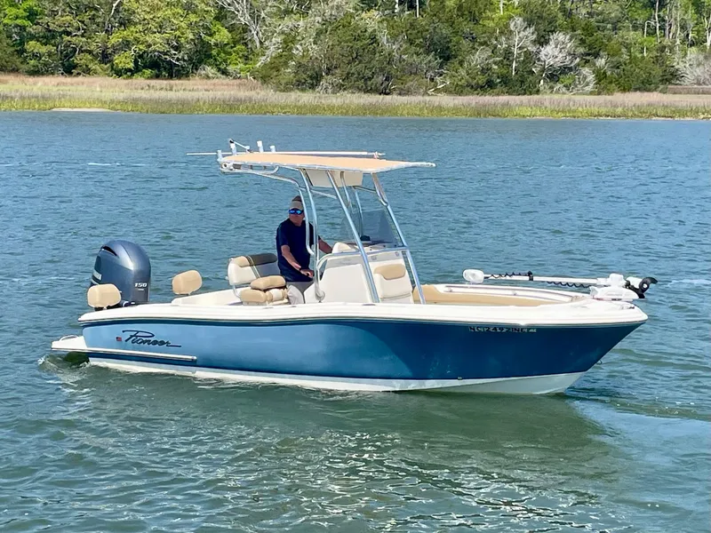 Slide: The Image of 2020 Pioneer 202 Sportfish boat on calm water. - 2