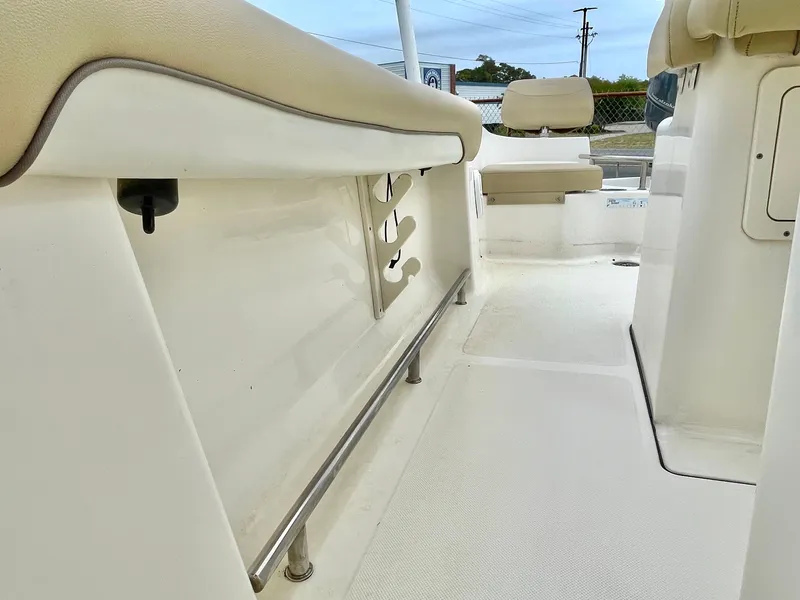 Slide: The Image of Interior of a 2020 Pioneer 202 Sportfish boat, beige upholstery. - 31
