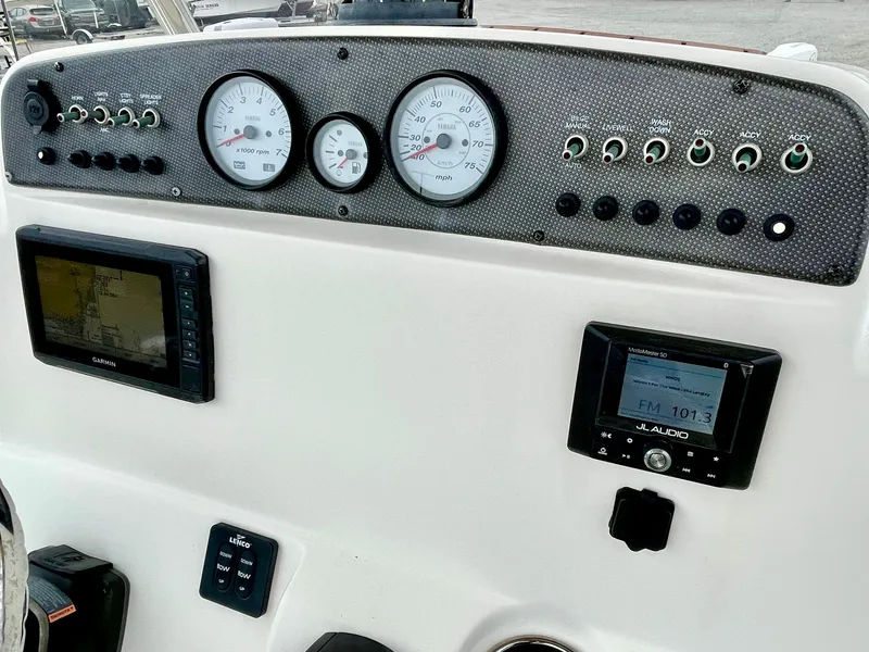Slide: The Image of Dashboard of 2020 Pioneer 202 Sportfish boat with Garmin and JL Audio. - 39