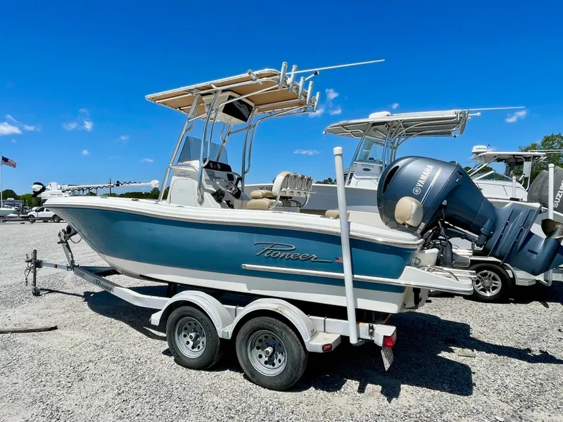 Slide: The Image of 2020 Pioneer 202 Sportfish boat on trailer, blue sky. - 7