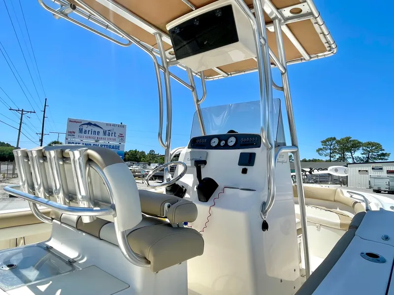 Slide: The Image of Pioneer 2020 202 Sportfish boat with helm console and seating area. - 8