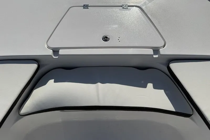 Slide: The Image of 2025 Tidewater 2210 Carolina Bay boat interior with storage compartment. - 2