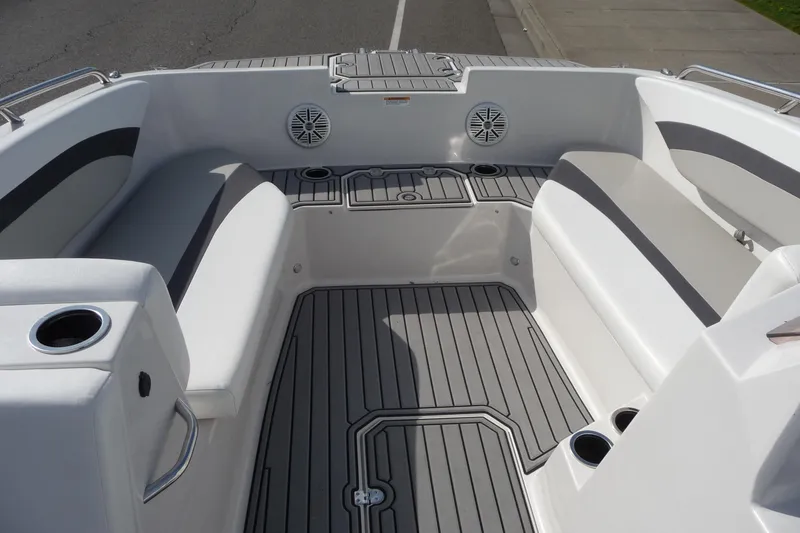 Slide: The Image of 2022 Starcraft SVX 171 OB boat interior with cushioned seating and cup holders. - 15