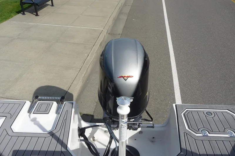 Slide: The Image of 2022 Starcraft SVX 171 OB boat engine on a trailer, parked on a street. - 18