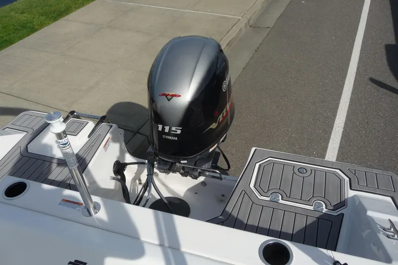 Slide: The Image of 2022 Starcraft SVX 171 OB boat with Yamaha 115 outboard motor, docked on pavement. - 19