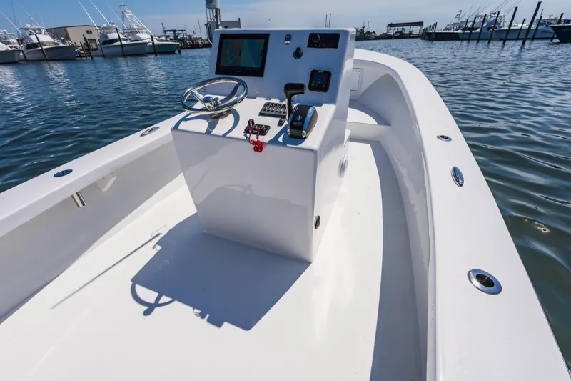 Slide: The Image of 1979 Privateer 20 boat on calm water in harbor. - 10
