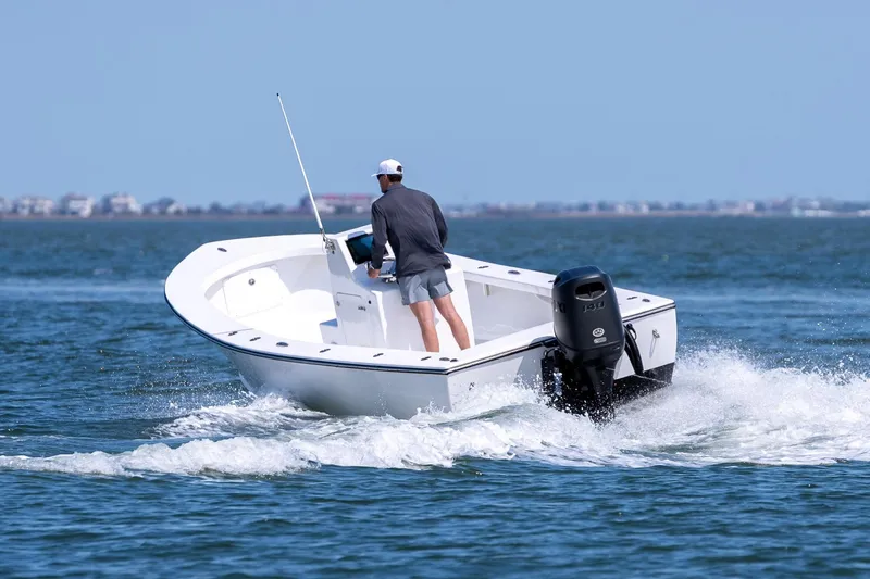 Slide: The Image of Man driving 1979 Privateer 20 boat on the sea. - 2