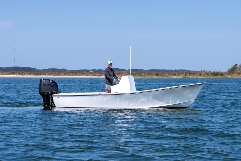 Slide: The Image of 1979 Privateer 20 boat on calm water with Suzuki engine. - 4