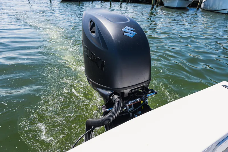 Slide: The Image of Outboard motor on a 1979 Privateer 20 boat cruising through water. - 6