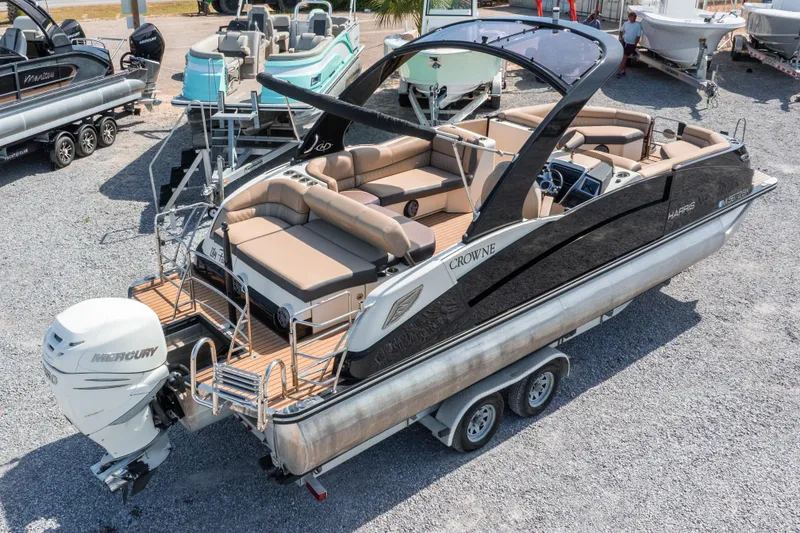 Slide: The Image of 2016 Harris Crowne 250 pontoon boat with Mercury engine on trailer. - 11