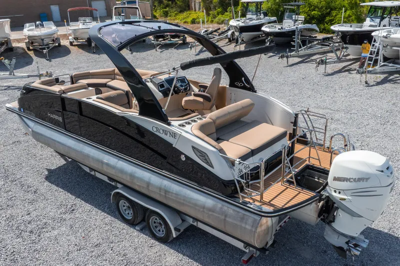 Slide: The Image of 2016 Harris Crowne 250 pontoon boat with Mercury outboard engine on trailer. - 13