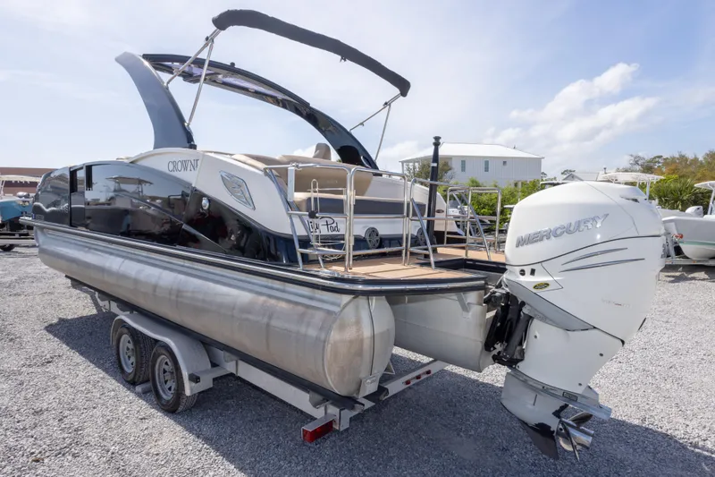 Slide: The Image of 2016 Harris Crowne 250 pontoon boat with Mercury outboard engine on a trailer. - 14