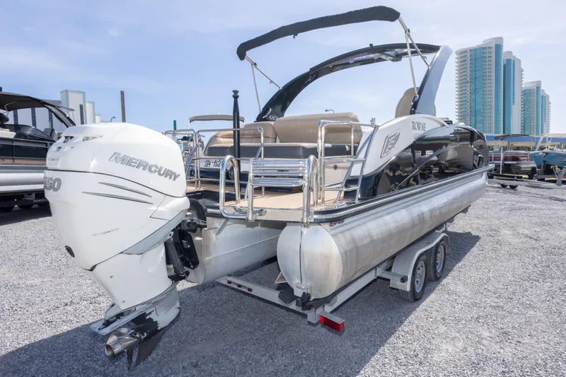 Slide: The Image of 2016 Harris Crowne 250 pontoon boat with Mercury outboard engine on trailer. - 17
