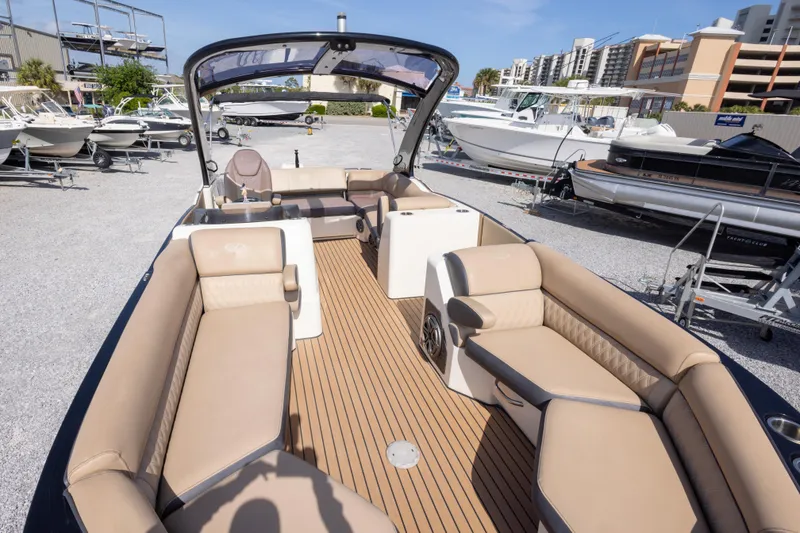 Slide: The Image of 2016 Harris Crowne 250 pontoon boat with luxurious seating and spacious deck layout. - 32