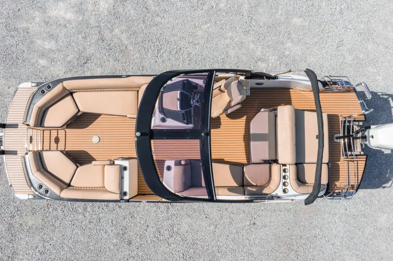 Slide: The Image of Overhead view of 2016 Harris Crowne 250 pontoon boat with tan seating and wood deck. - 5