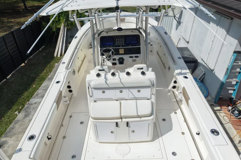 Slide: The Image of 2015 Robalo R300 Center Console boat with spacious deck and modern controls. - 10