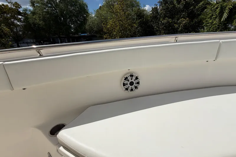 Slide: The Image of 2015 Robalo R300 Center Console boat interior with speaker and cushioned seating. - 11
