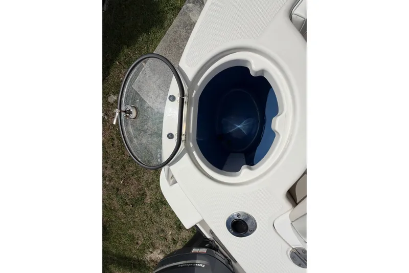 Slide: The Image of Open hatch on 2015 Robalo R300 Center Console boat, showing interior compartment. - 15