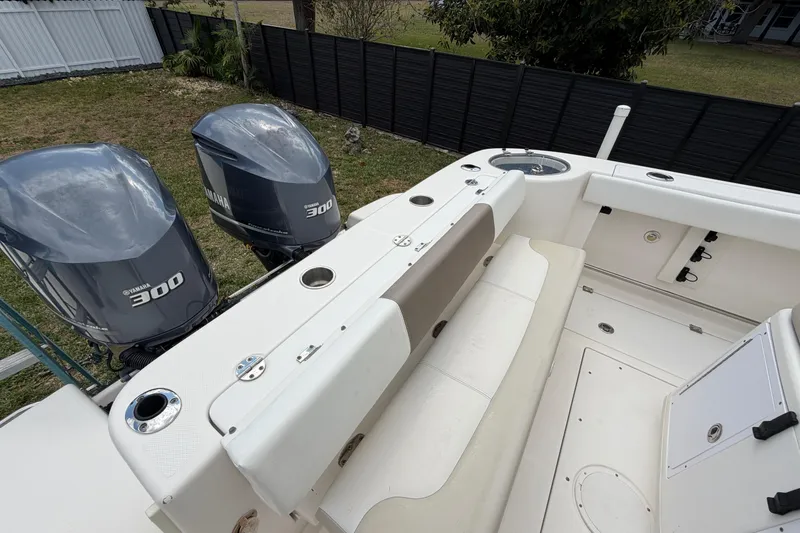 Slide: The Image of 2015 Robalo R300 Center Console boat with twin Yamaha 300 engines, featuring spacious seating. - 17